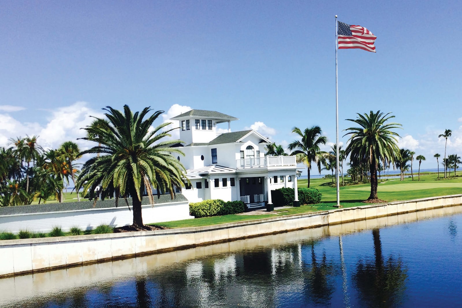 Outside shot of a building on the golf course with an American flag flying
